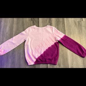 This is a comfy sweater/sweatshirt. It is warm and soft on the inside and out.